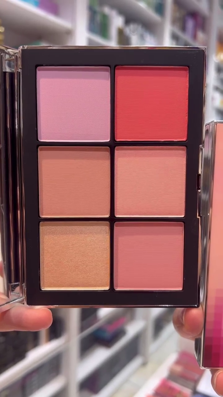 A beautiful blush and highlighter palette featuring a range of soft pink and coral tones, perfect for adding a radiant flush to the cheeks.